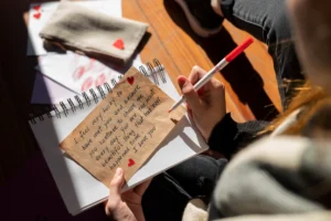 woman writing romantic love letter someone (1)